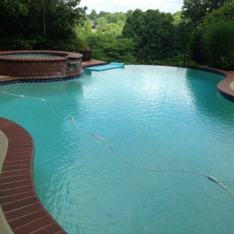 Crack repair and deck resurface made this backyard pool complete! - Suwannee, GA