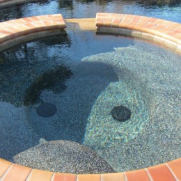 Midnight Blue Pebble surface and 'Autumn Leaves' coping -- Braselton, GA